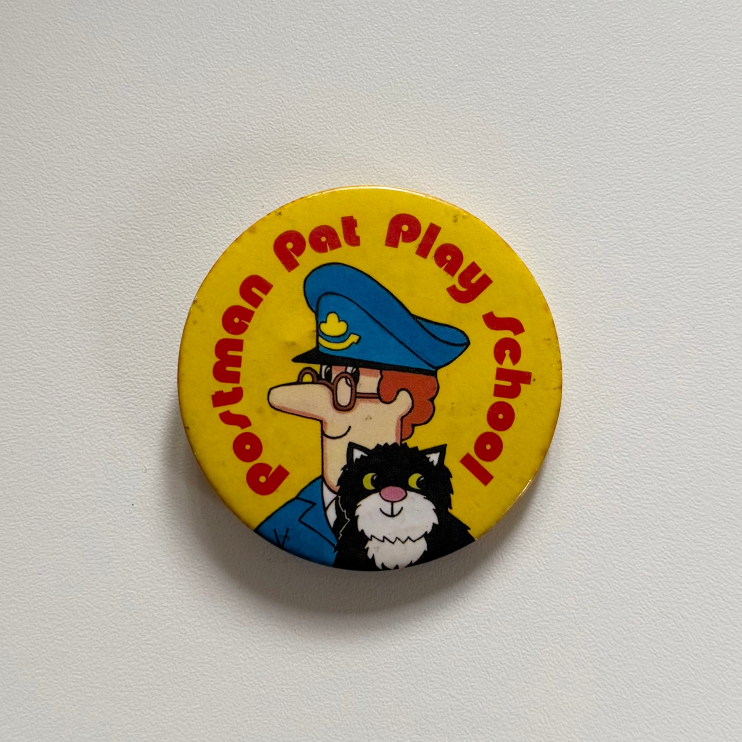 Vintage postman Pat badge. Has signs of age round the edge