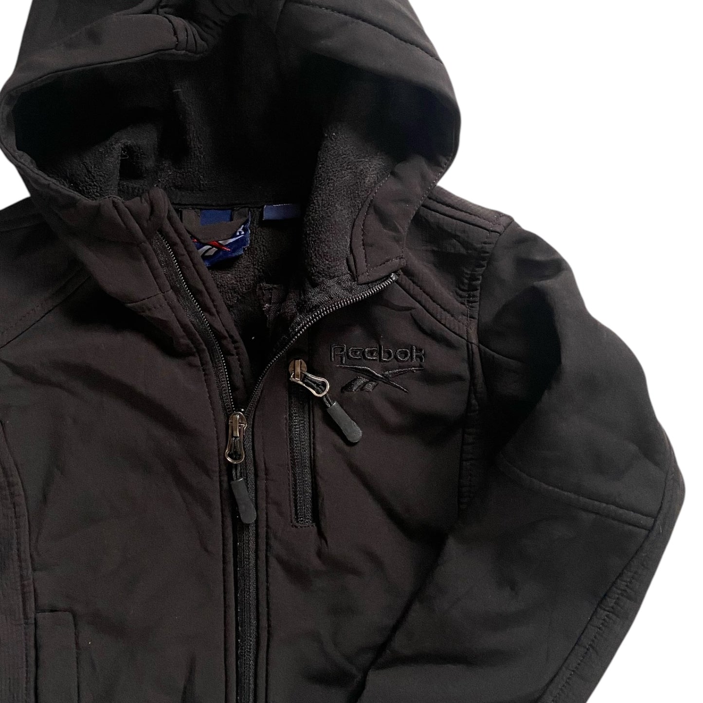 Black zip up reebok coat. Size 4 years