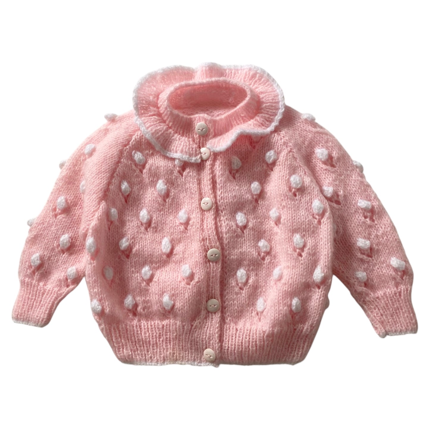 Pink spotty knitted cardigan. Size approx 2 years