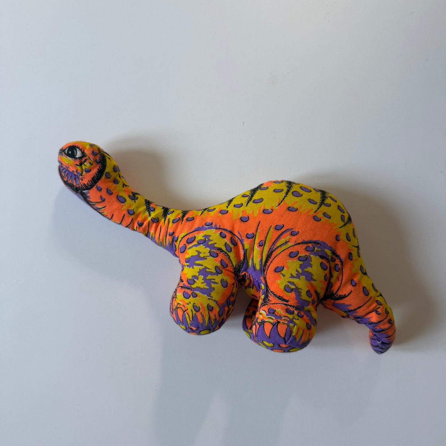 Vintage dinosaur plush doll.