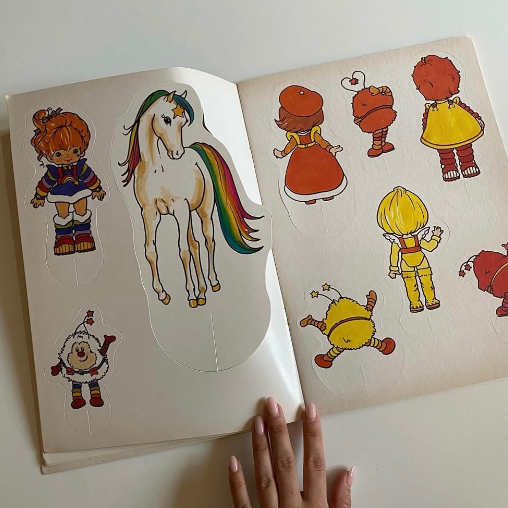 Vintage st Michael 1983 rainbow Brite activity book with press out play set. Has a few drawings but mostly good condition.
