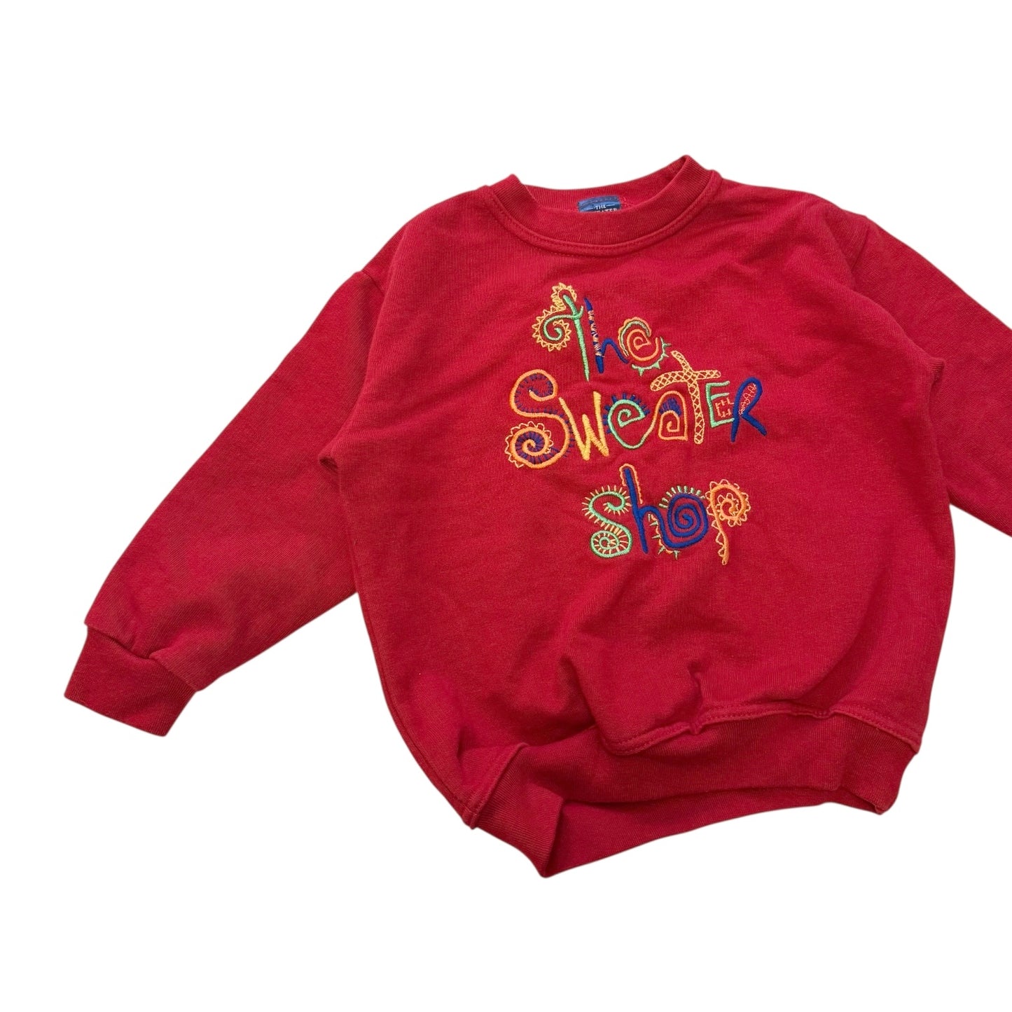 The sweater shop sweatshirt. Size imo 3-4 years