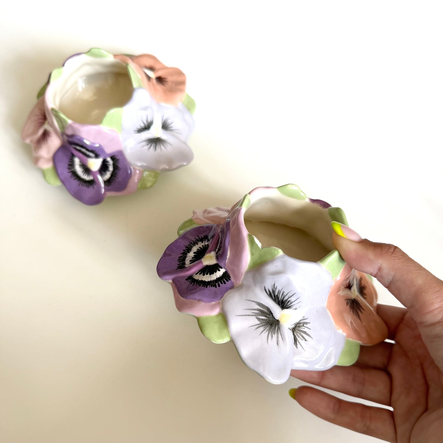 Vintage ceramic homemade pansy pots/ candle holders. One has a small chip as shown.