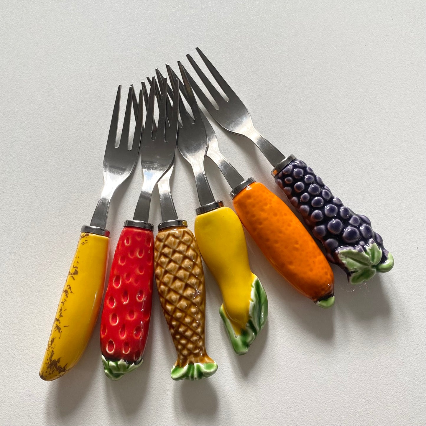 Vintage mid century stainless steel ceramic fruit forks