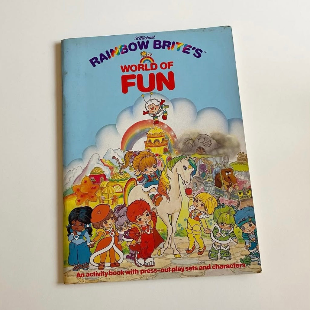 Vintage st Michael 1983 rainbow Brite activity book with press out play set. Has a few drawings but mostly good condition.
