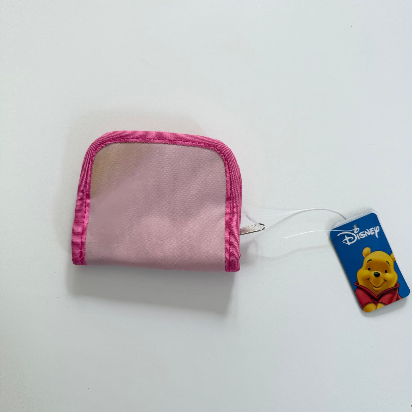 Vintage pink Winnie the Pooh zip up purse. Has a mark on the back as shown. Might be able to be washed?