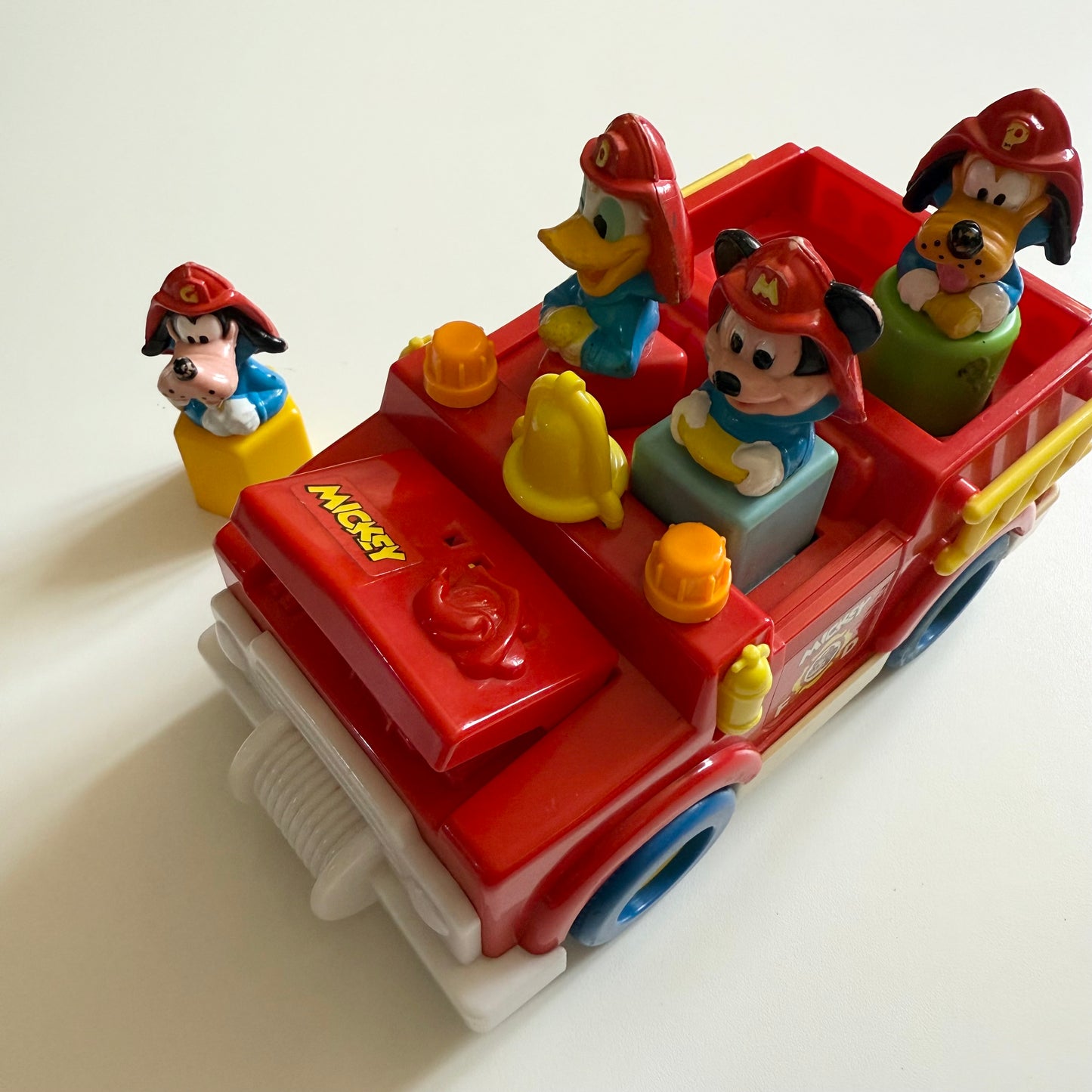 Vintage 1989 Disney fire truck vechile. When you take out the characters bonnet opens and boot etc.