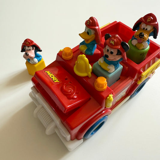 Vintage 1989 Disney fire truck vechile. When you take out the characters bonnet opens and boot etc.