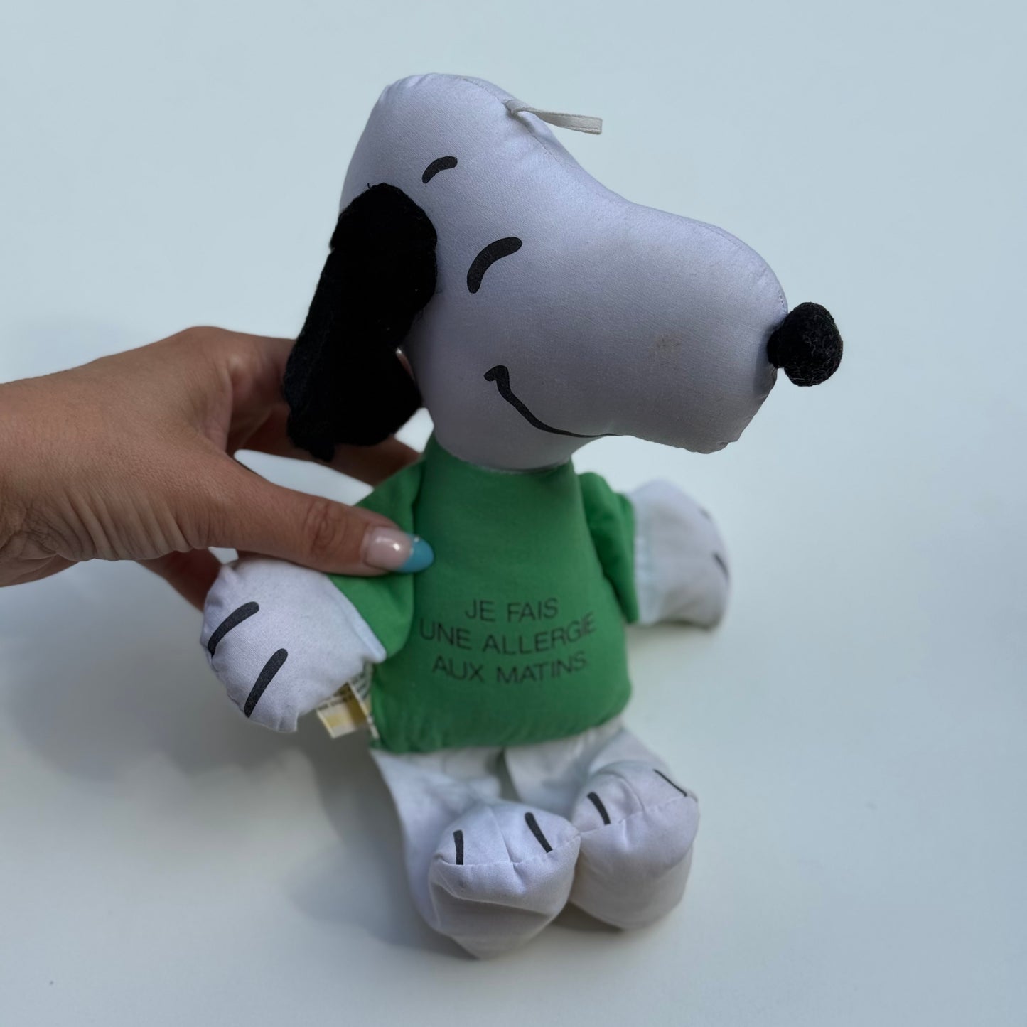Vintage 1966 Snoopy plush toy with French text