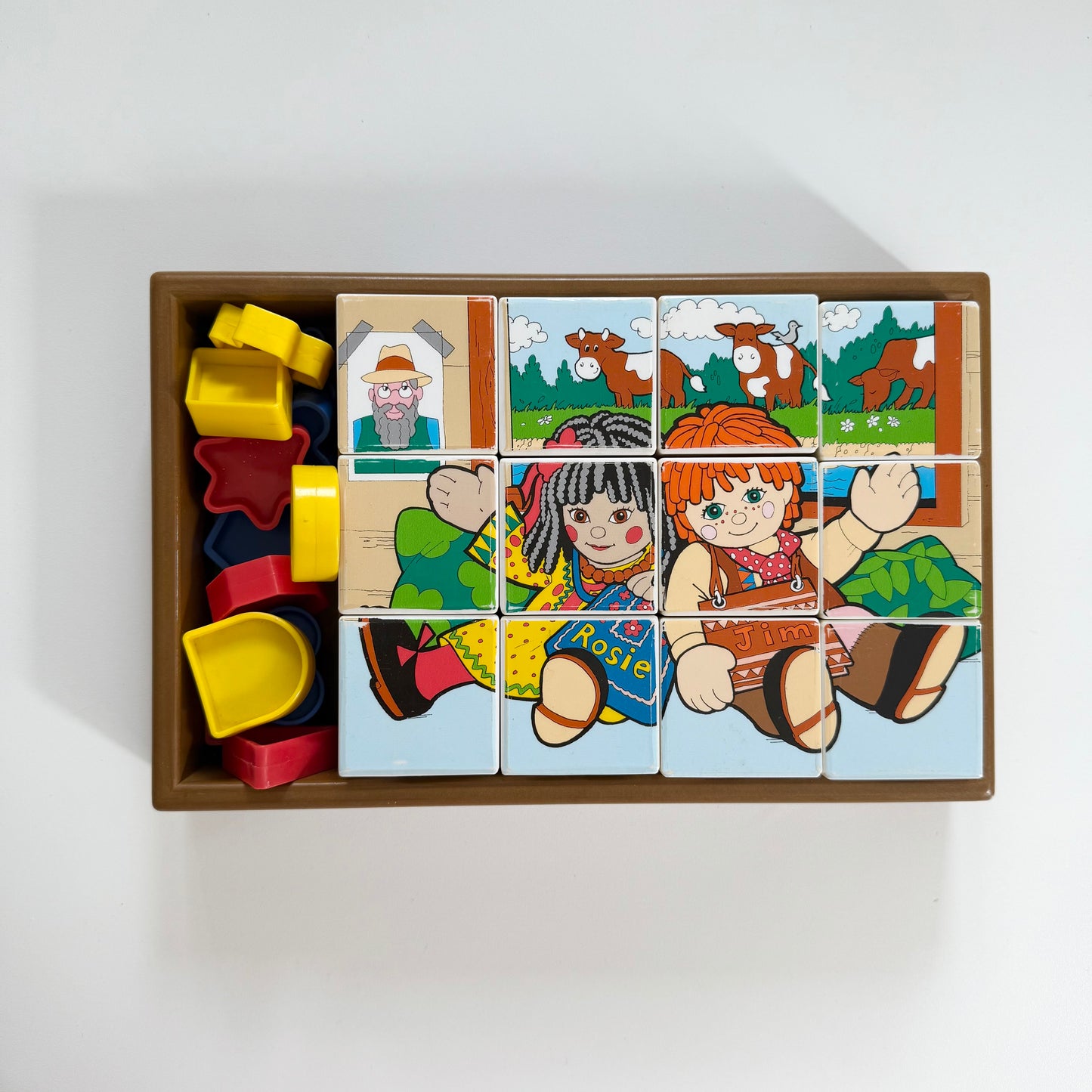 Vintage Rosie and Jim box of blocks. Has two puzzles and a shape game too.