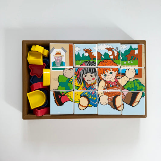 Vintage Rosie and Jim box of blocks. Has two puzzles and a shape game too.