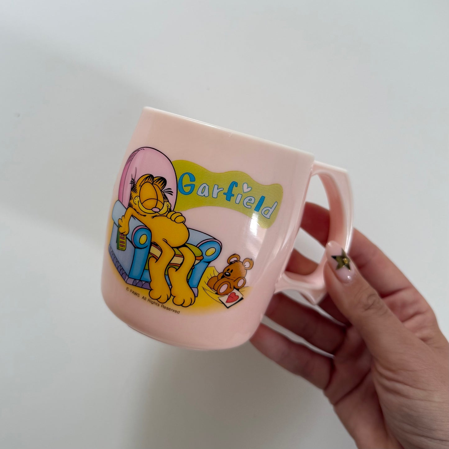 Pale pink garfield plastic mug