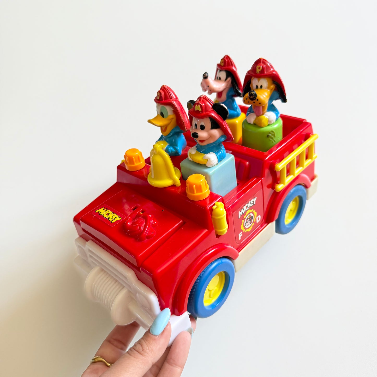 Vintage 1989 Disney fire truck vechile. When you take out the characters bonnet opens and boot etc.