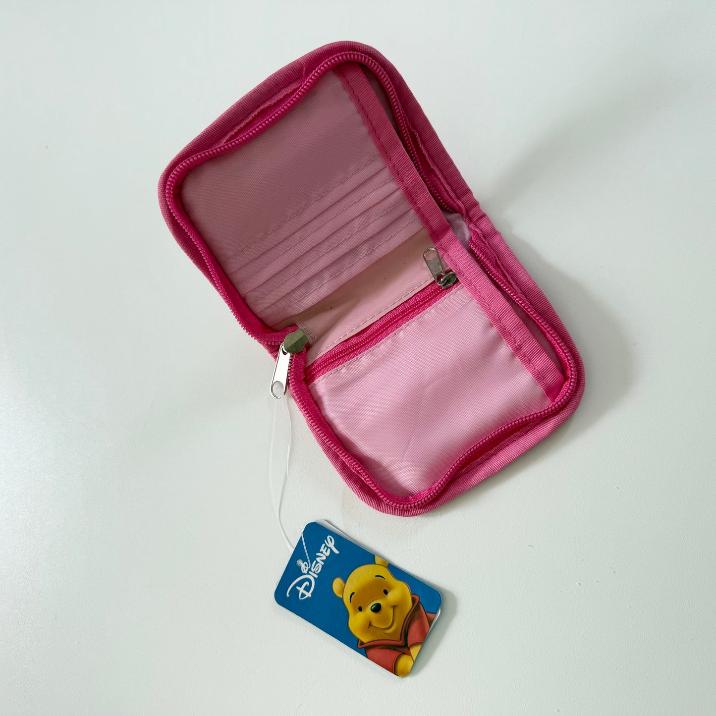 Vintage pink Winnie the Pooh zip up purse. Has a mark on the back as shown. Might be able to be washed?