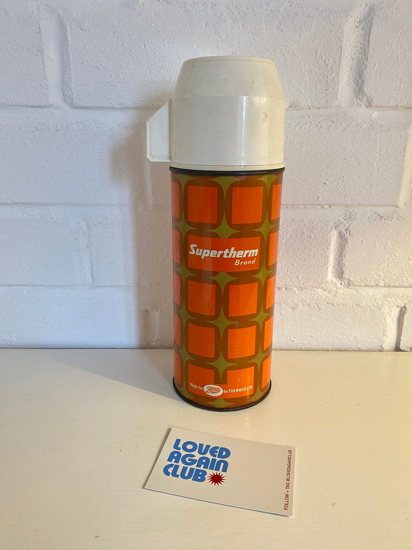 Vintage Supertherm thermos flask in orange