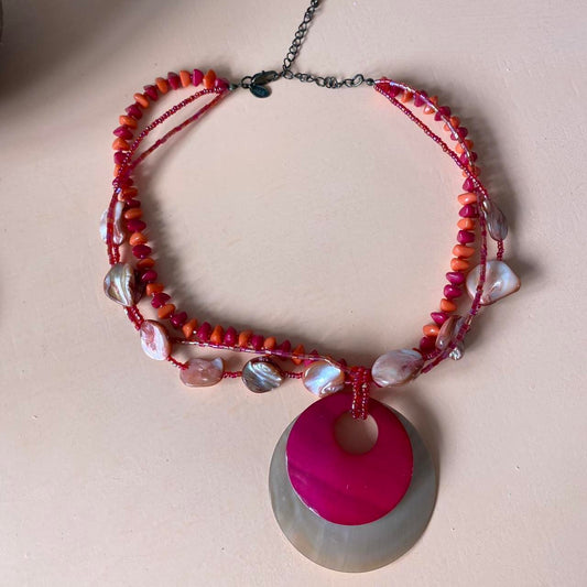 Pretty coral red / pink layered choker necklace with statement circular pendant