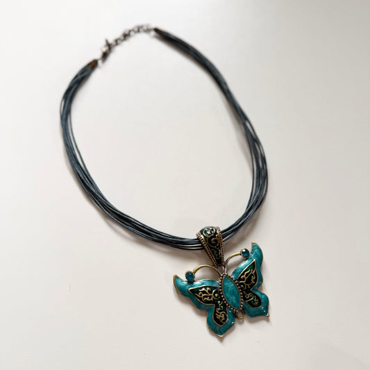 Vintage Y2K turquoise blue butterfly necklace. Clasp fastening