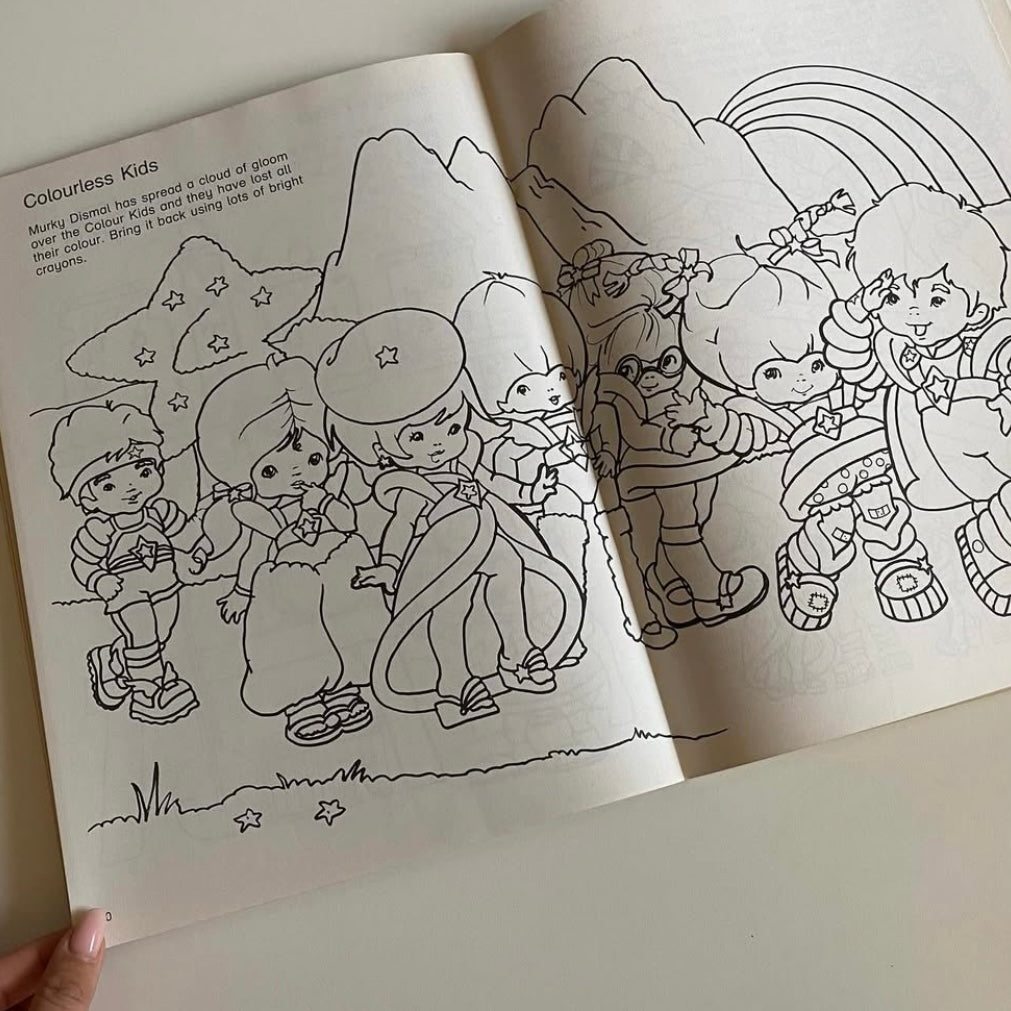 Vintage st Michael 1983 rainbow Brite activity book with press out play set. Has a few drawings but mostly good condition.