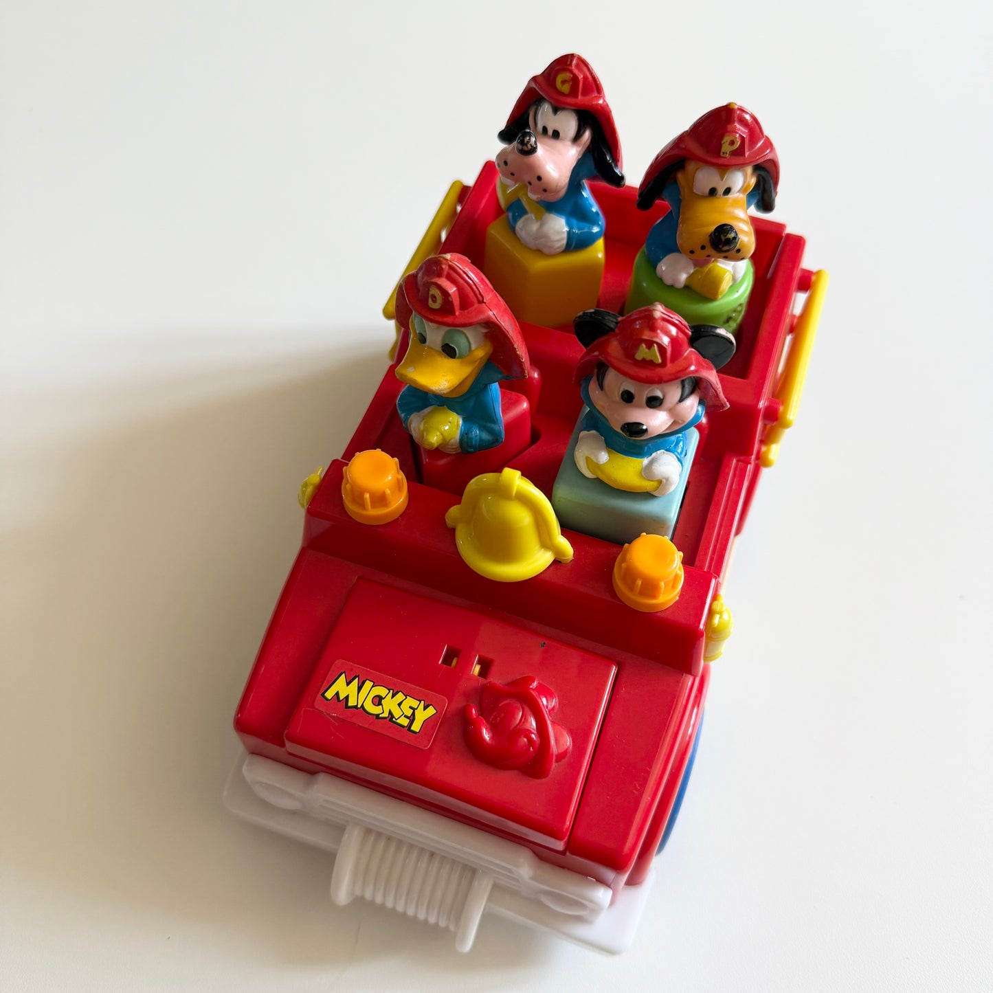 Vintage 1989 Disney fire truck vechile. When you take out the characters bonnet opens and boot etc.