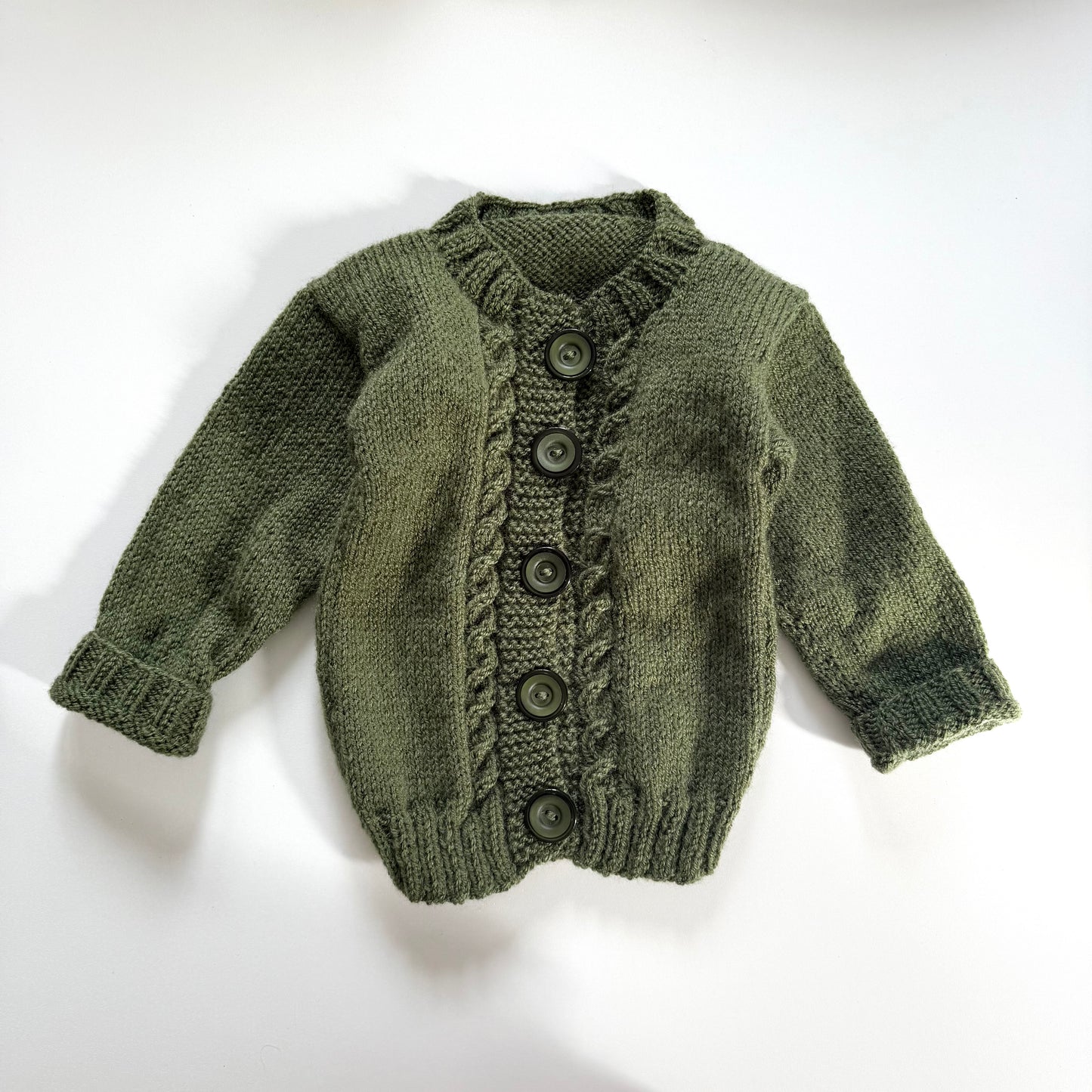 Vintage dark green knitted cardigan. Size approx 6-9 months