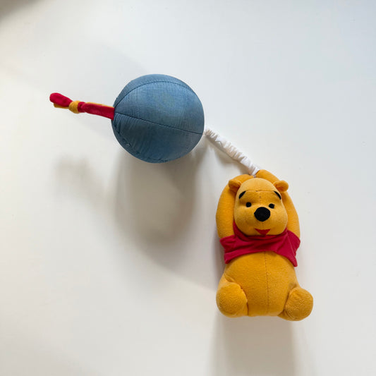 Vintage Winnie the Pooh musical toy. Can clip onto a pram or cot.