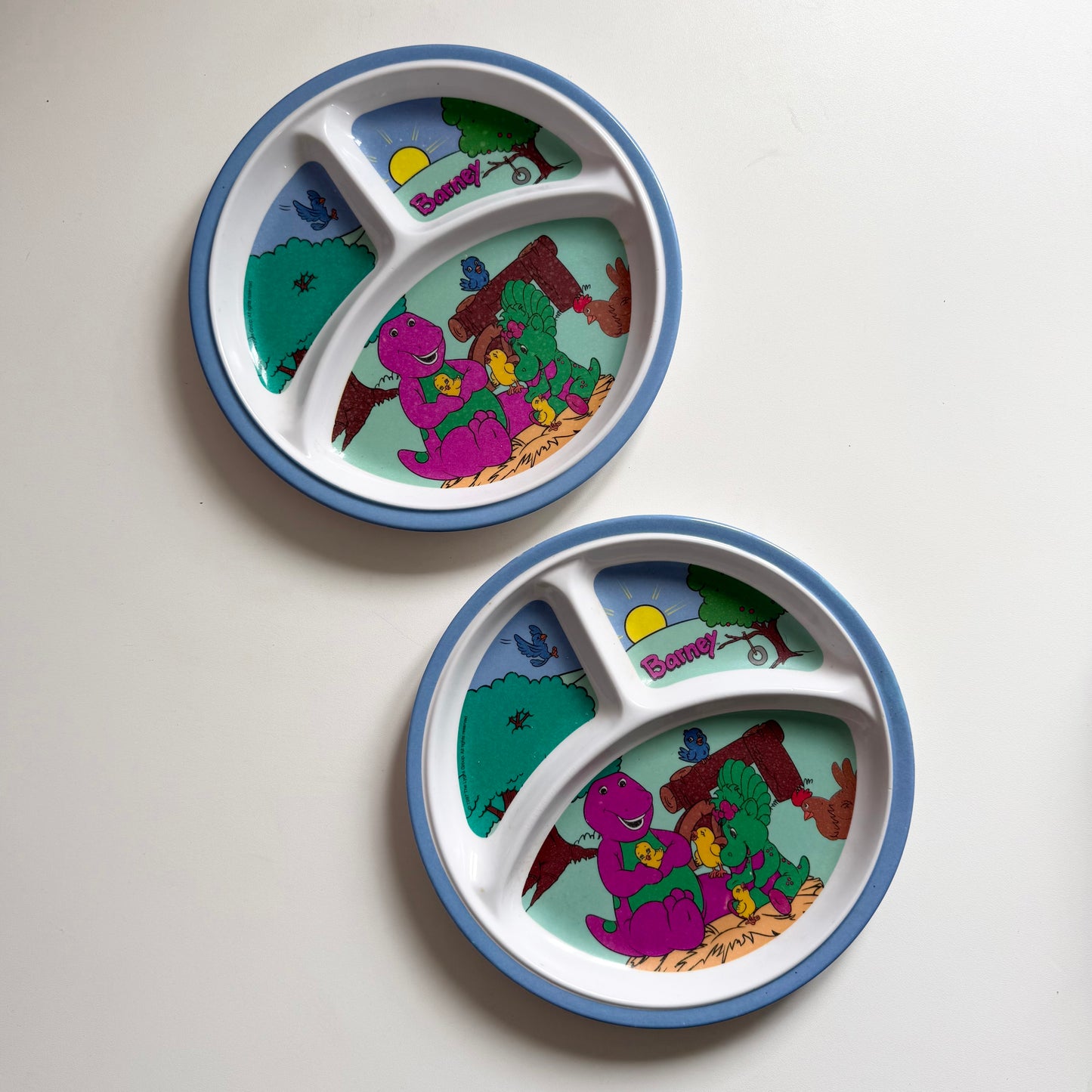 Set of vintage 1997 Barney melamine plates. Condition as shown.