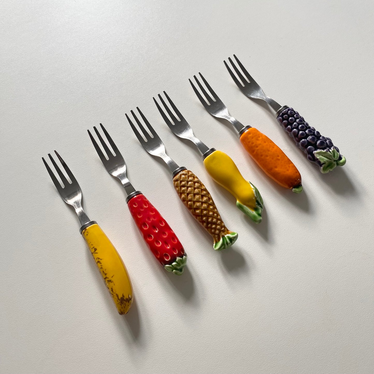Vintage mid century stainless steel ceramic fruit forks
