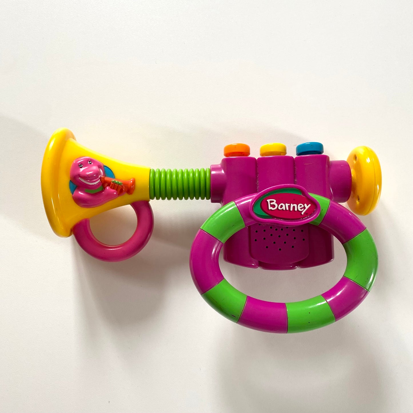 Vintage Barney trumpet sound toy.