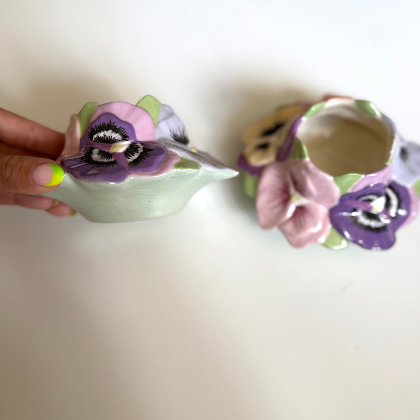 Vintage ceramic homemade pansy pots/ candle holders. One has a small chip as shown.