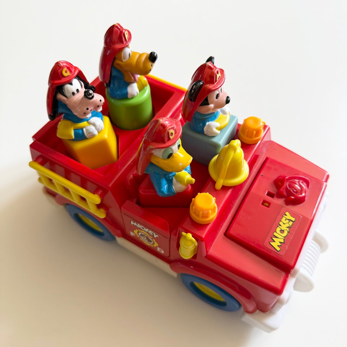 Vintage 1989 Disney fire truck vechile. When you take out the characters bonnet opens and boot etc.