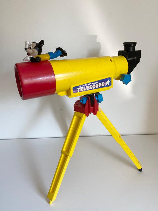 Vintage Mickey Mouse statement colourblock telescope. Has 20 different planet slides inside. Used condition scratches etc and is missing a black piece to the bottom ( doesn’t effect use!)