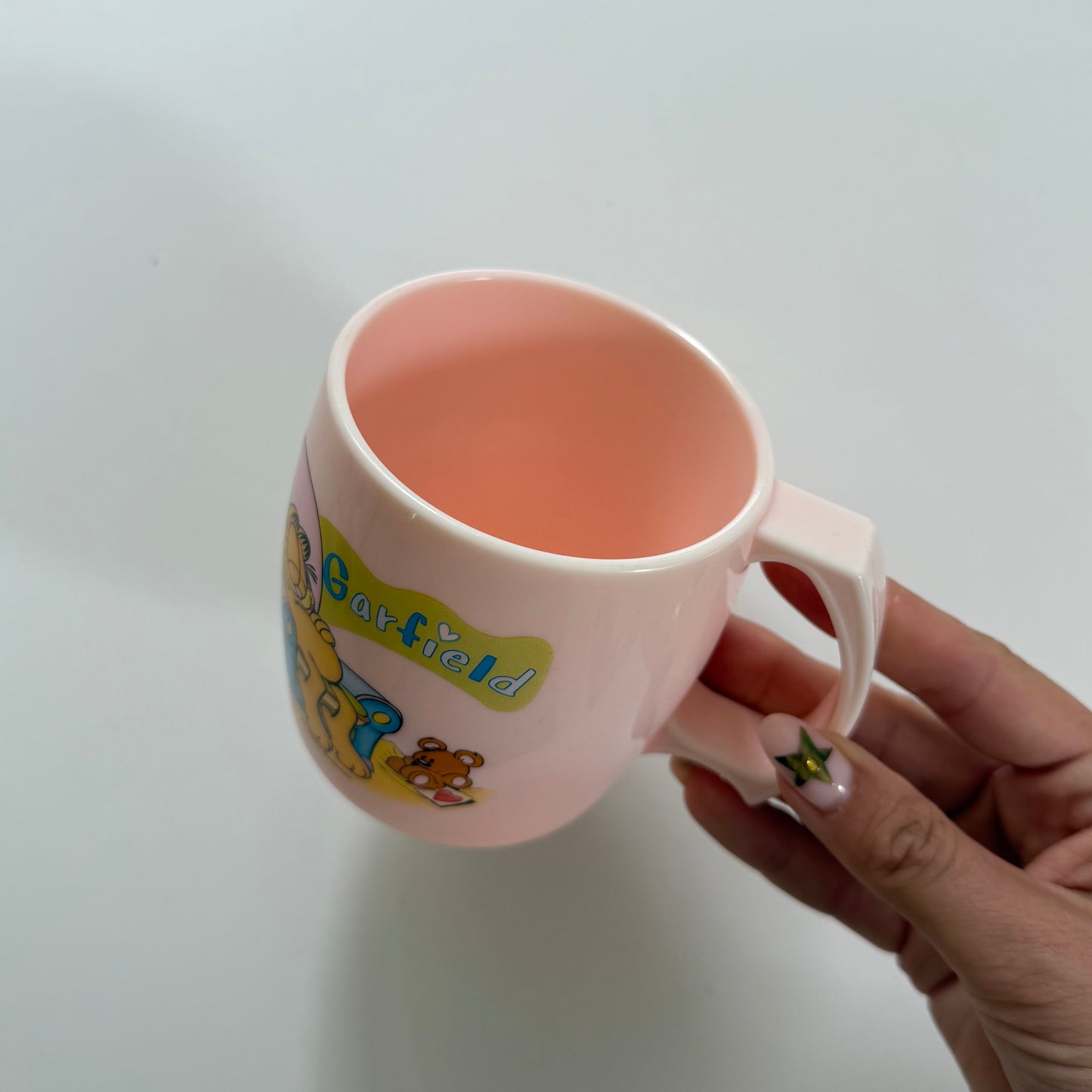 Pale pink garfield plastic mug