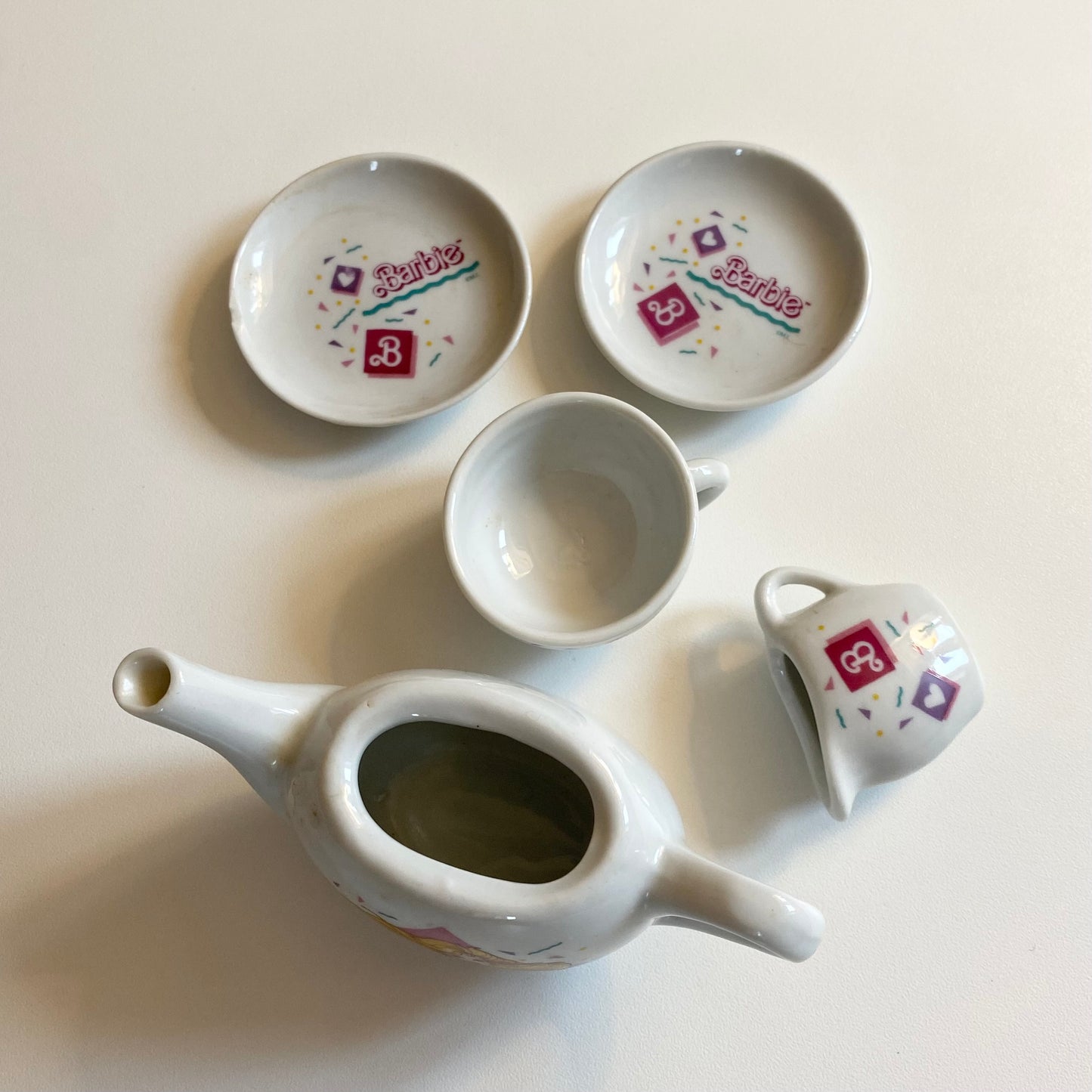 Vintage 90s ceramic tea set. As shown - One plate has a chip