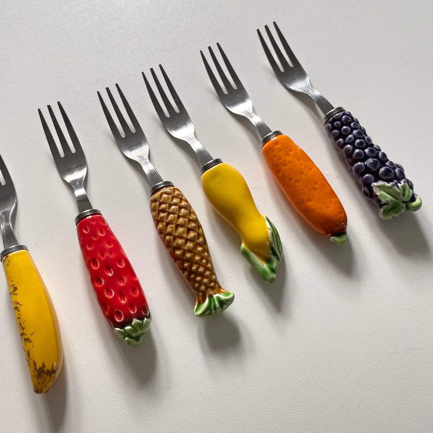 Vintage mid century stainless steel ceramic fruit forks