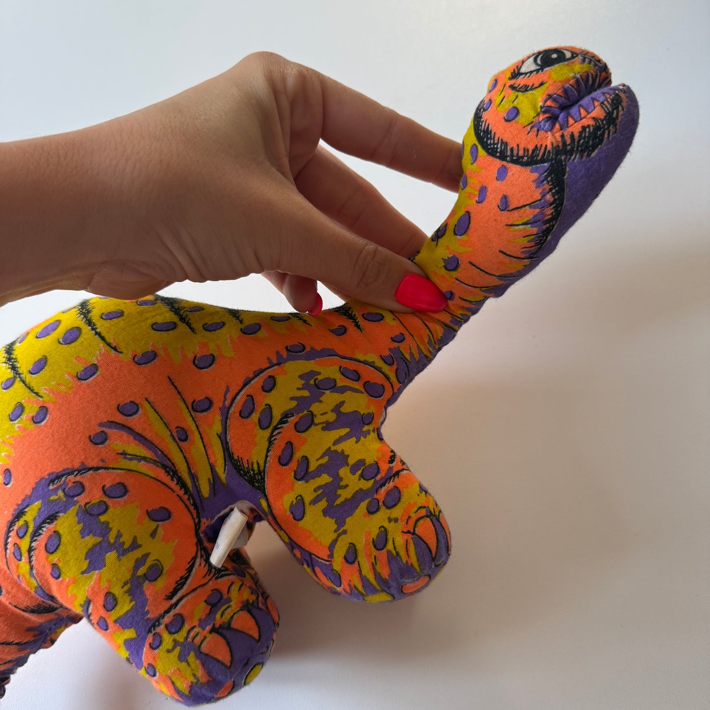Vintage dinosaur plush doll.