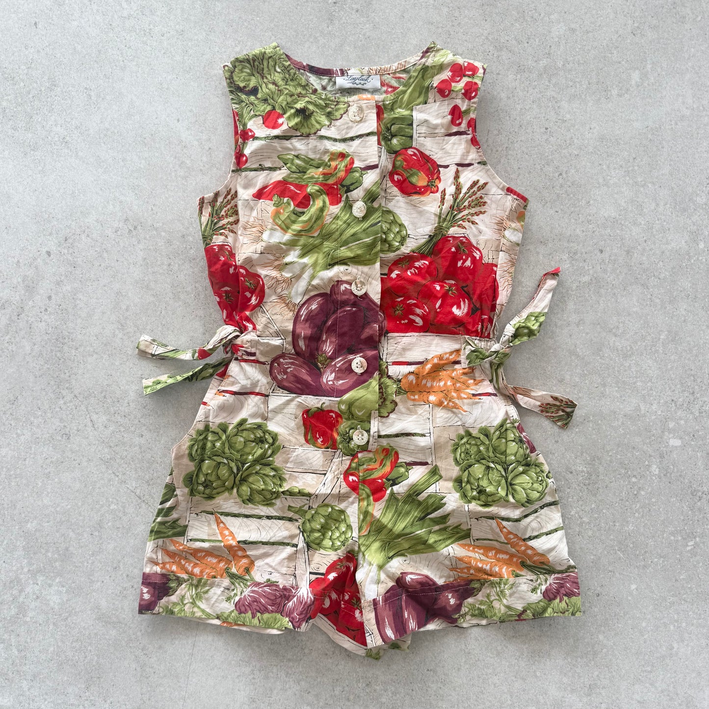 Vintage romper in vegetable garden print. Size approx 6-8 years