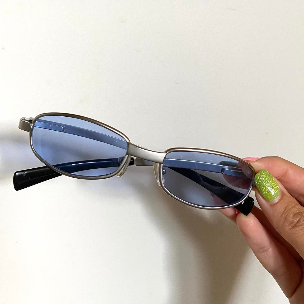 A super cool pair of Y2K sunglasses with blue shades & silver frame